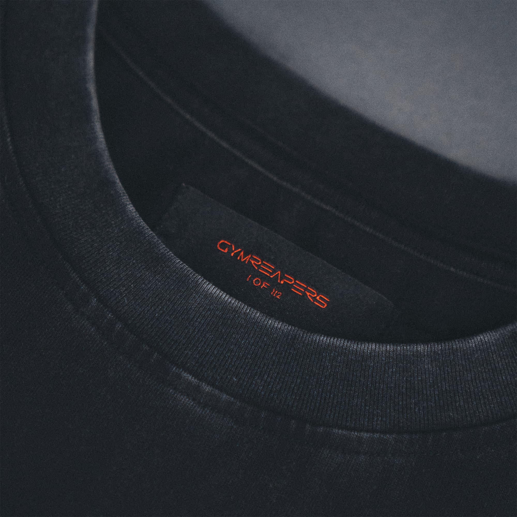 12th Anniversary Tee - Never Finished detail shot of tag