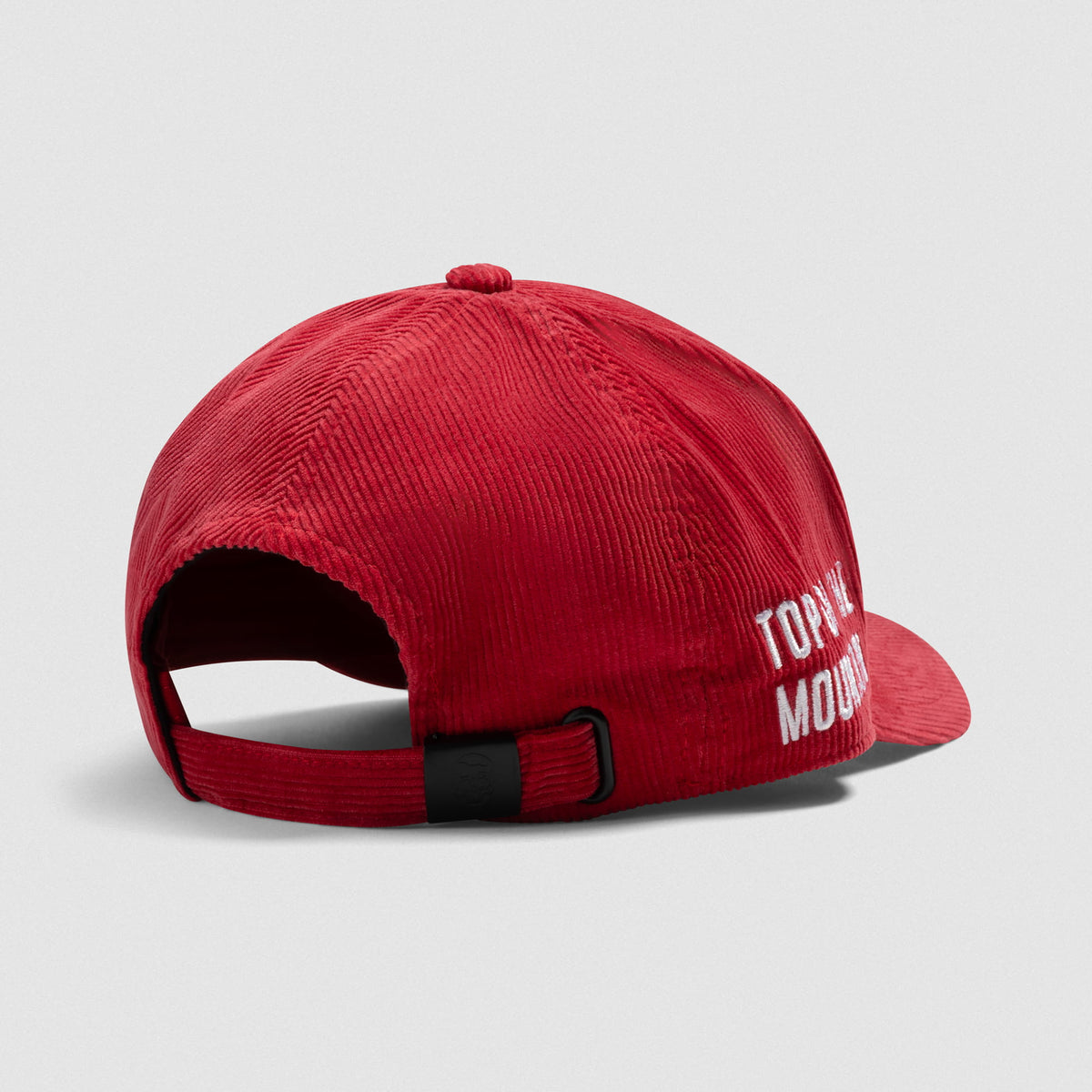 Back angle view of the Mr. Olympia Corduroy 5-Panel Hat that displays the adjustable clasp and the Top of the Mountain text on the side