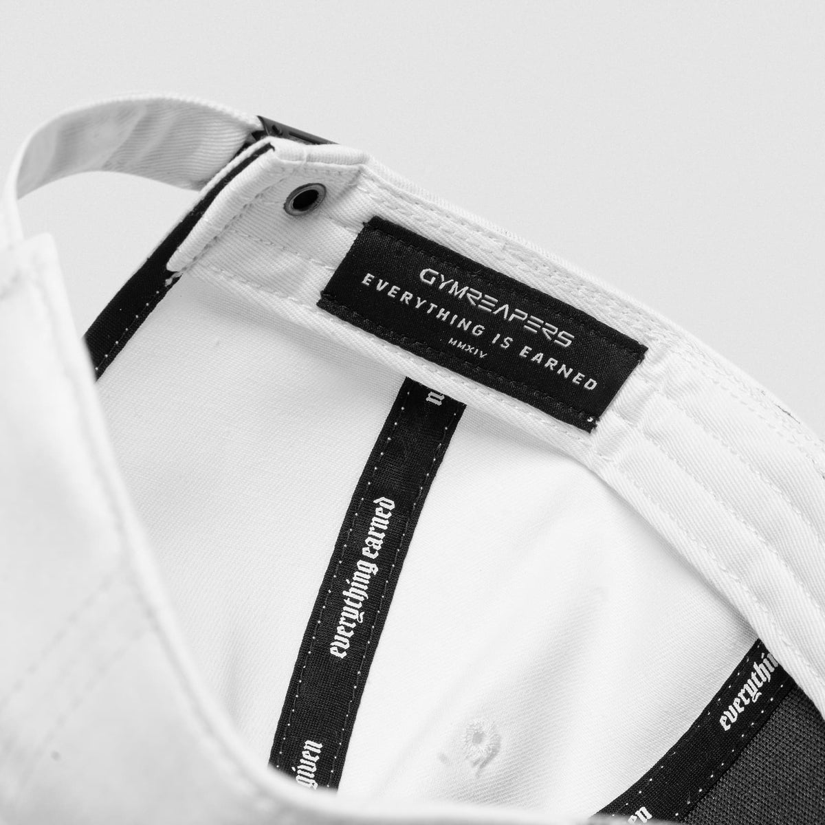 5-Panel Initial Hat - White Camo interior label and adjustable strap detail