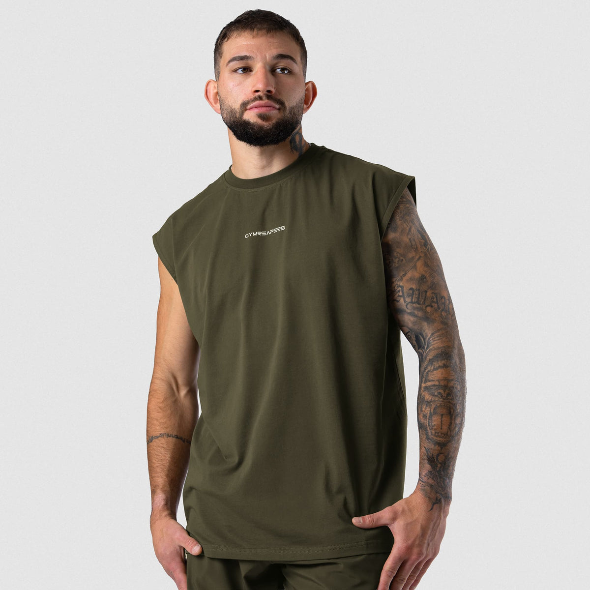 Male model wearing the Axis Cap Sleeve Tank - OD Green front view