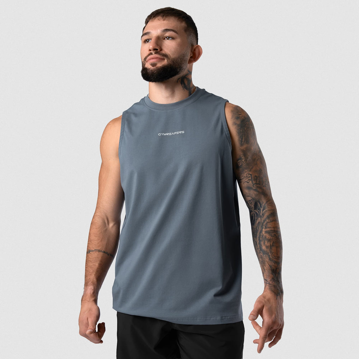 Man wearing Axis Muscle Tank - Lake front fit