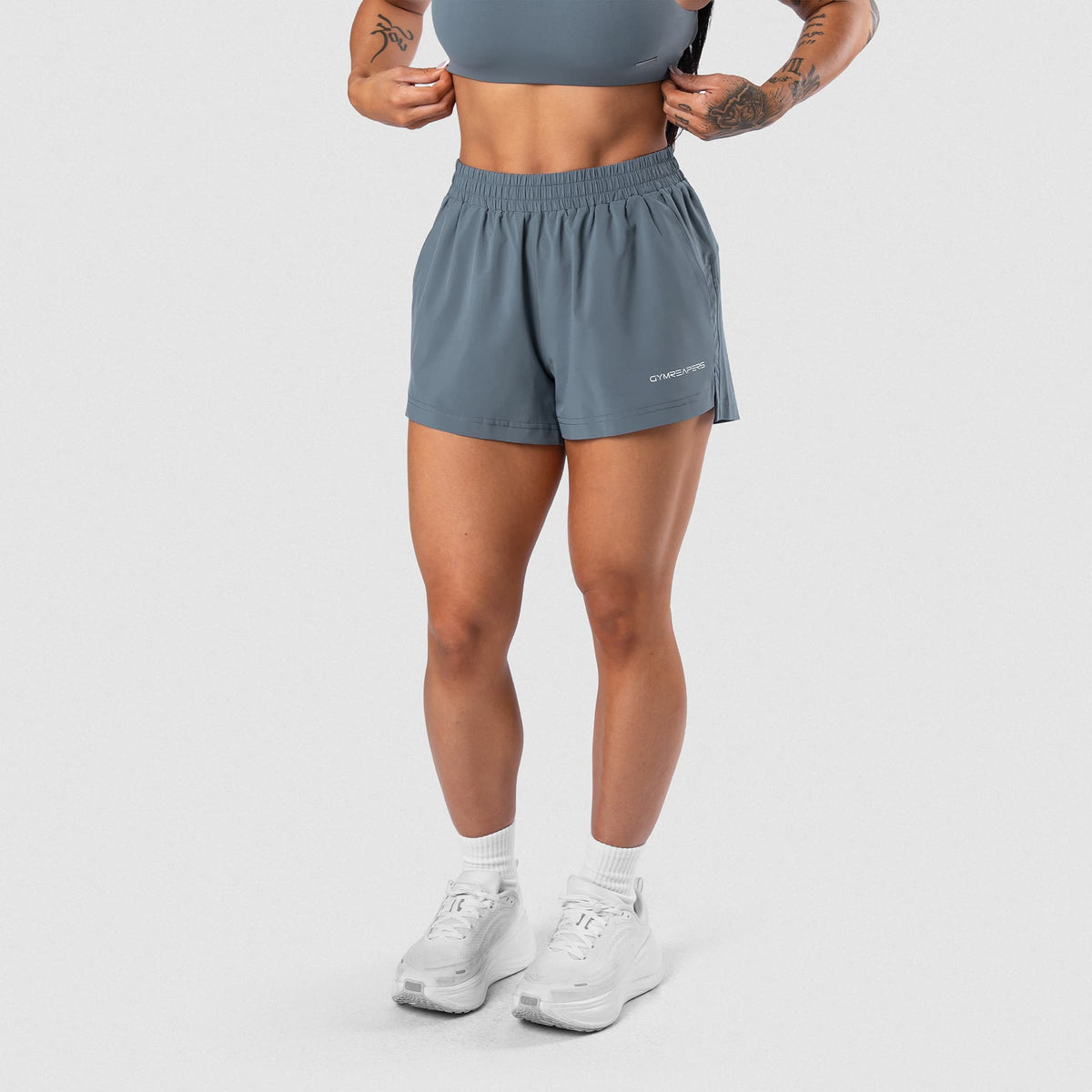 Female model wearing the Axis Sport Shorts - Lake front view