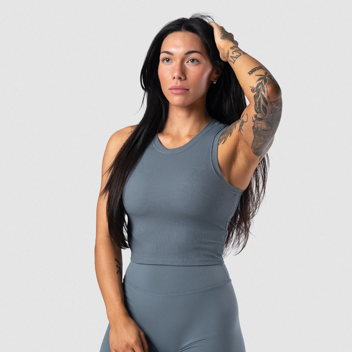 Female model wearing the Axis Support Tank - Lake front view