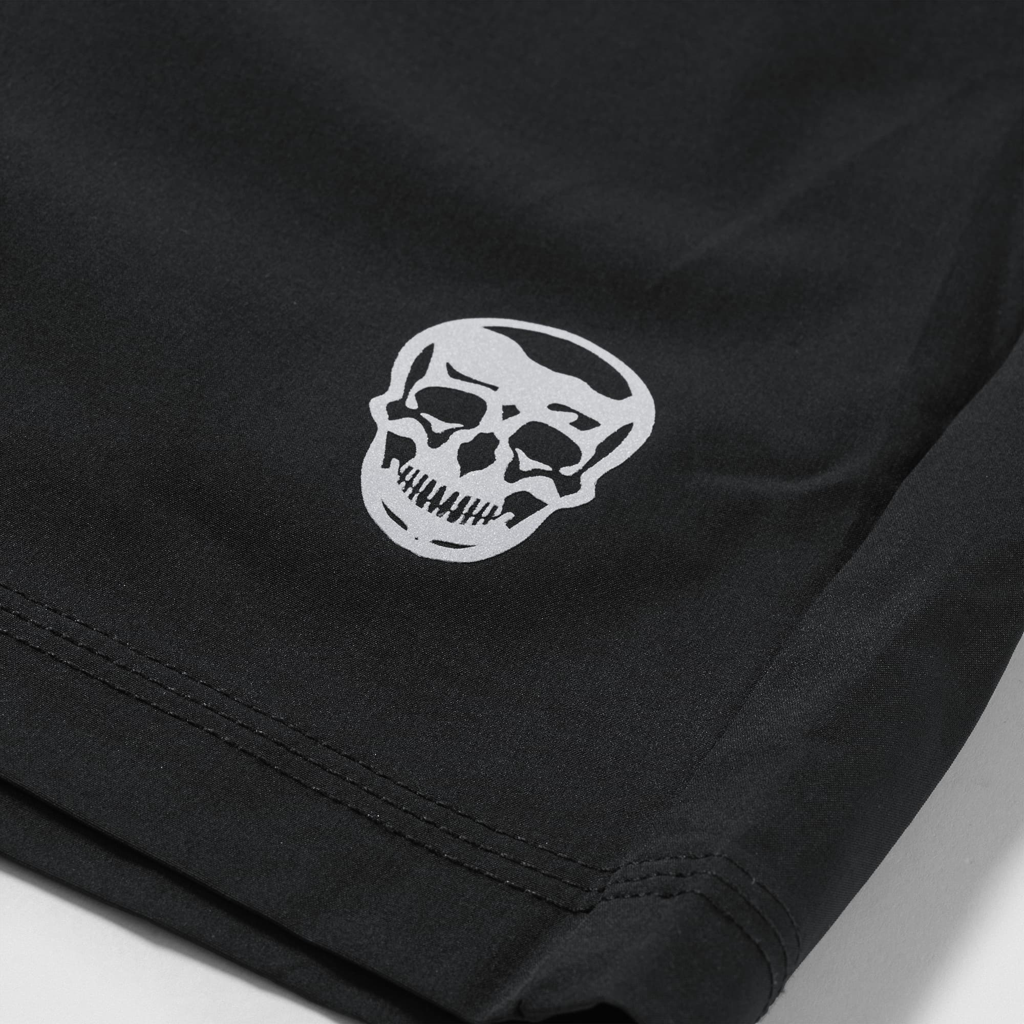 Reflective Gymreapers skull logo detail on Men's Conquer 5 Inch Shorts - Black
