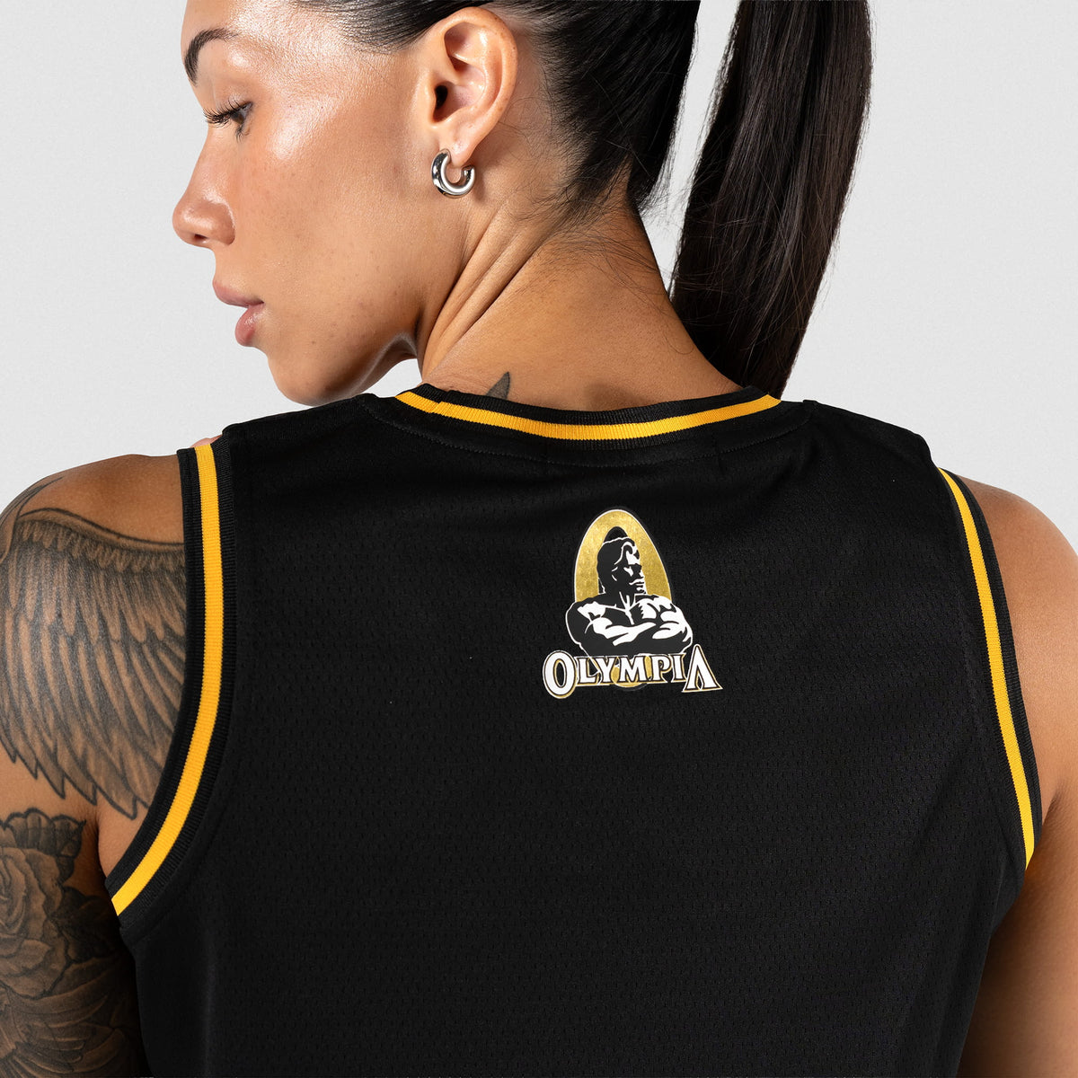 Champions Gold Crop Jersey | close up of center back Champions Gold Olympia bodybuilding event logo