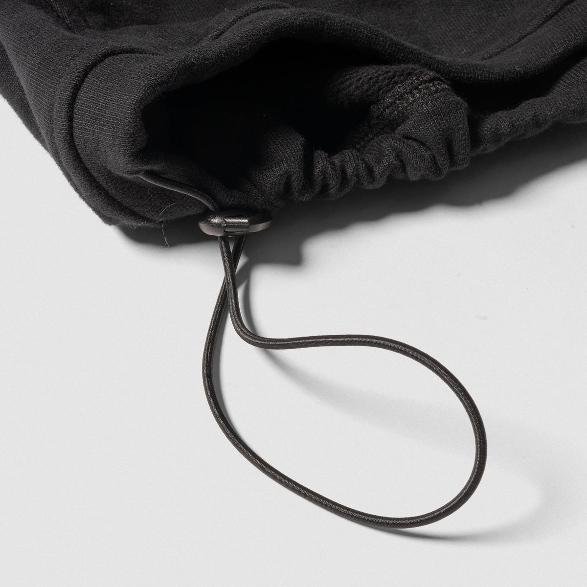 Champions Gold Cropped Zip-Up Hoodie | Close up of adjustable hem feature
