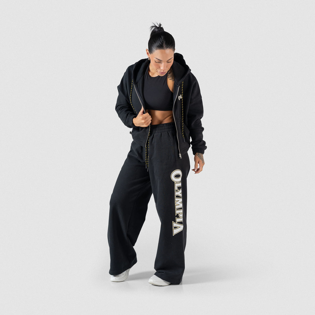 Champions Gold Cropped Zip-Up Hoodie | Full body front view of model wearing unzipped hoodie with matching Olympia Wide Leg Joggers
