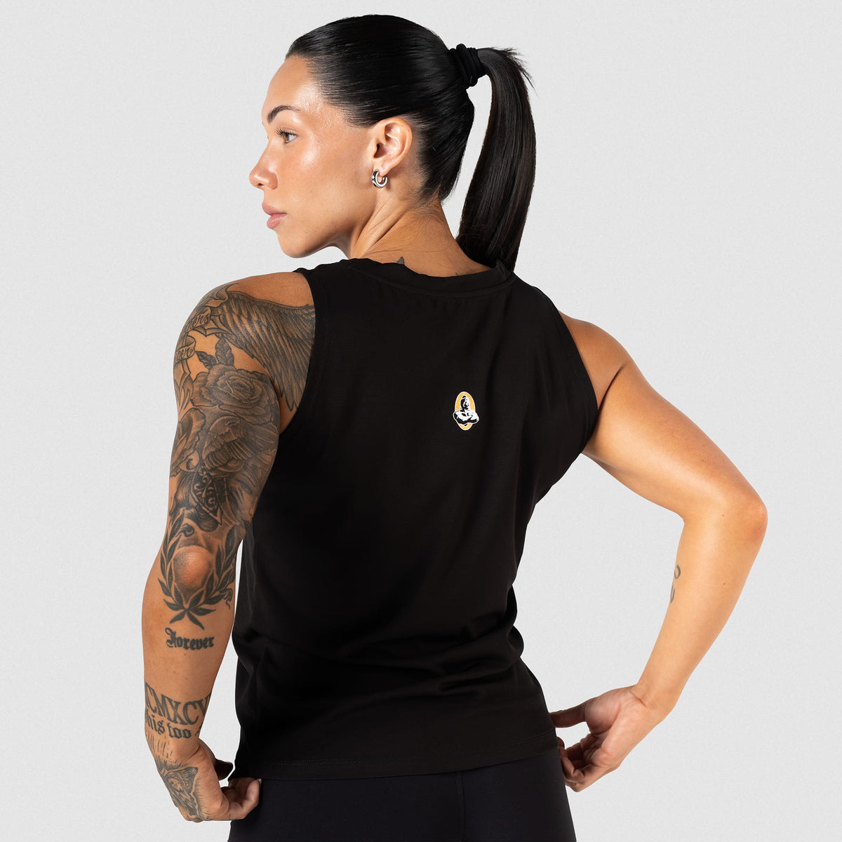 Back view of the Champions Gold Full Length Training Tank showcasing the small logo on the back