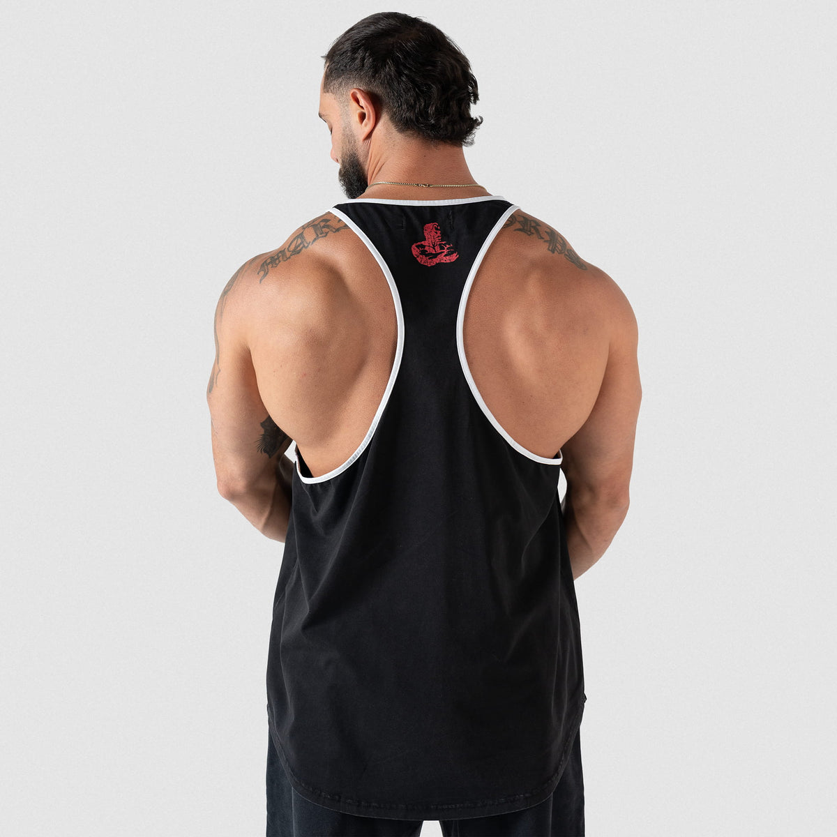 Back of the black Championship Stringer tank top on a male model