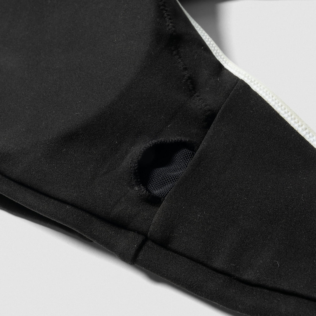 Close up of the insert hole for removable pads on the Olympia High Neck Bra