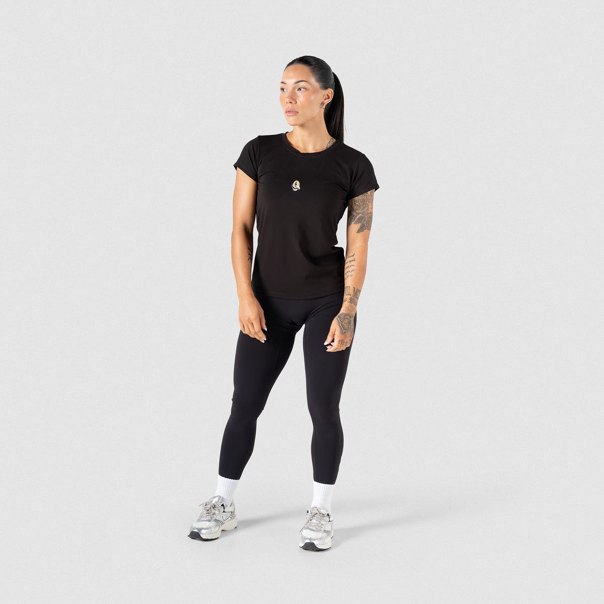 Full model front view of the Women's Olympia Legging in Black paired with a women's Olympia t-shirt