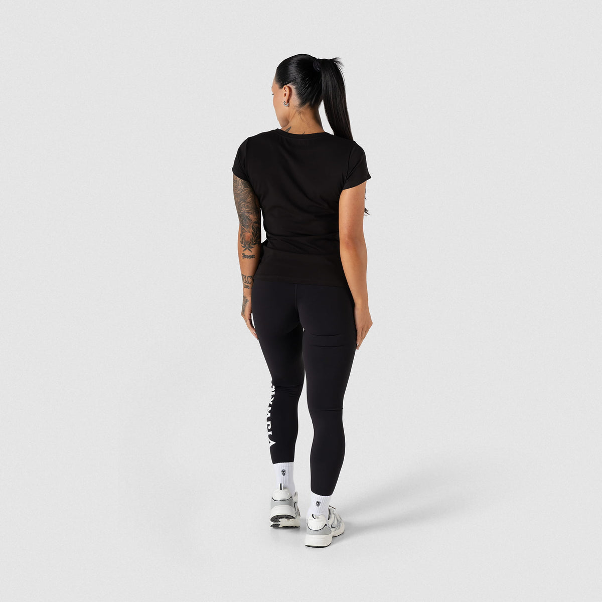 Full back view of the Women's Olympia Legging in Black paired with a black women's t-shirt