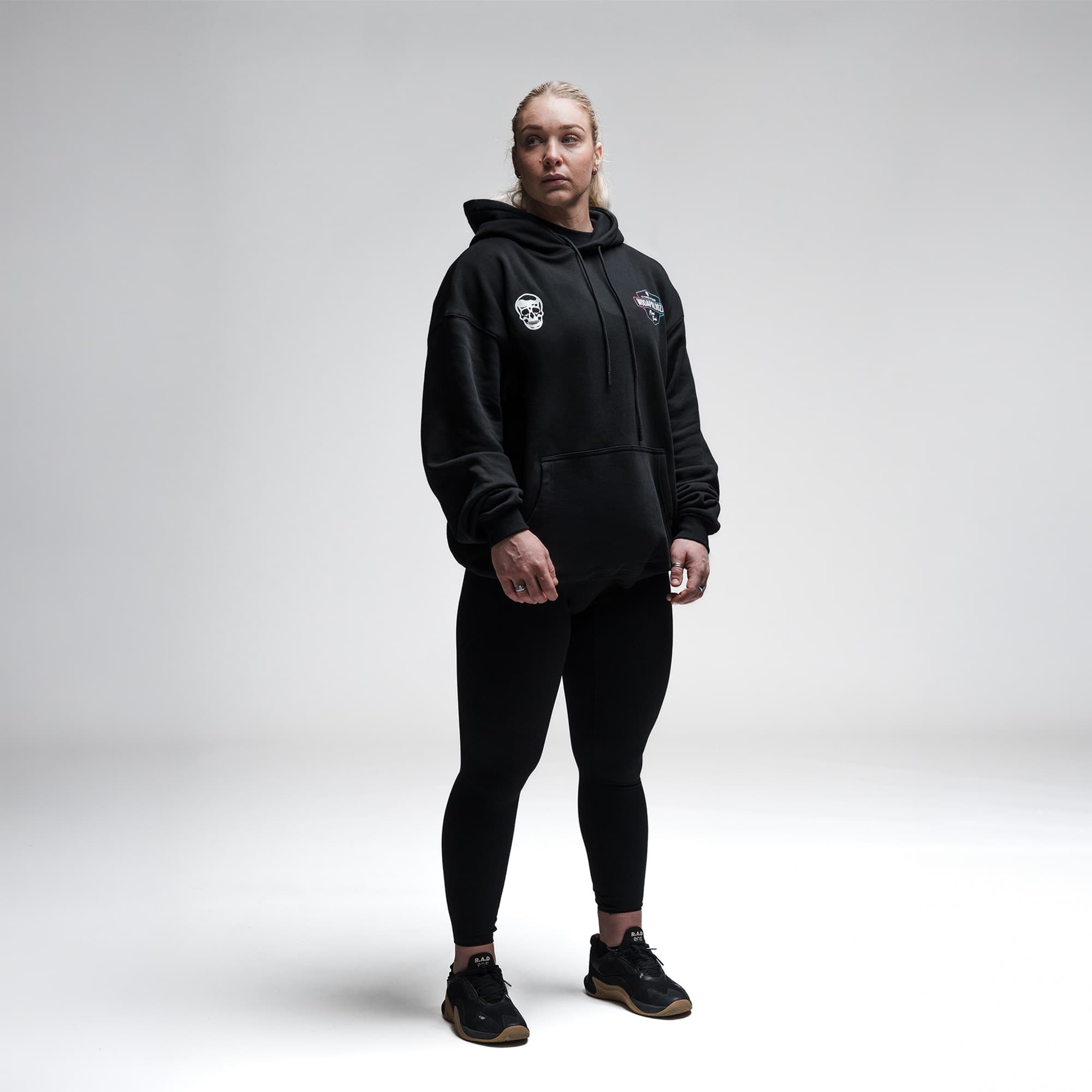 Female athlete wearing the Neon Horizon Hoodie full body shot front view