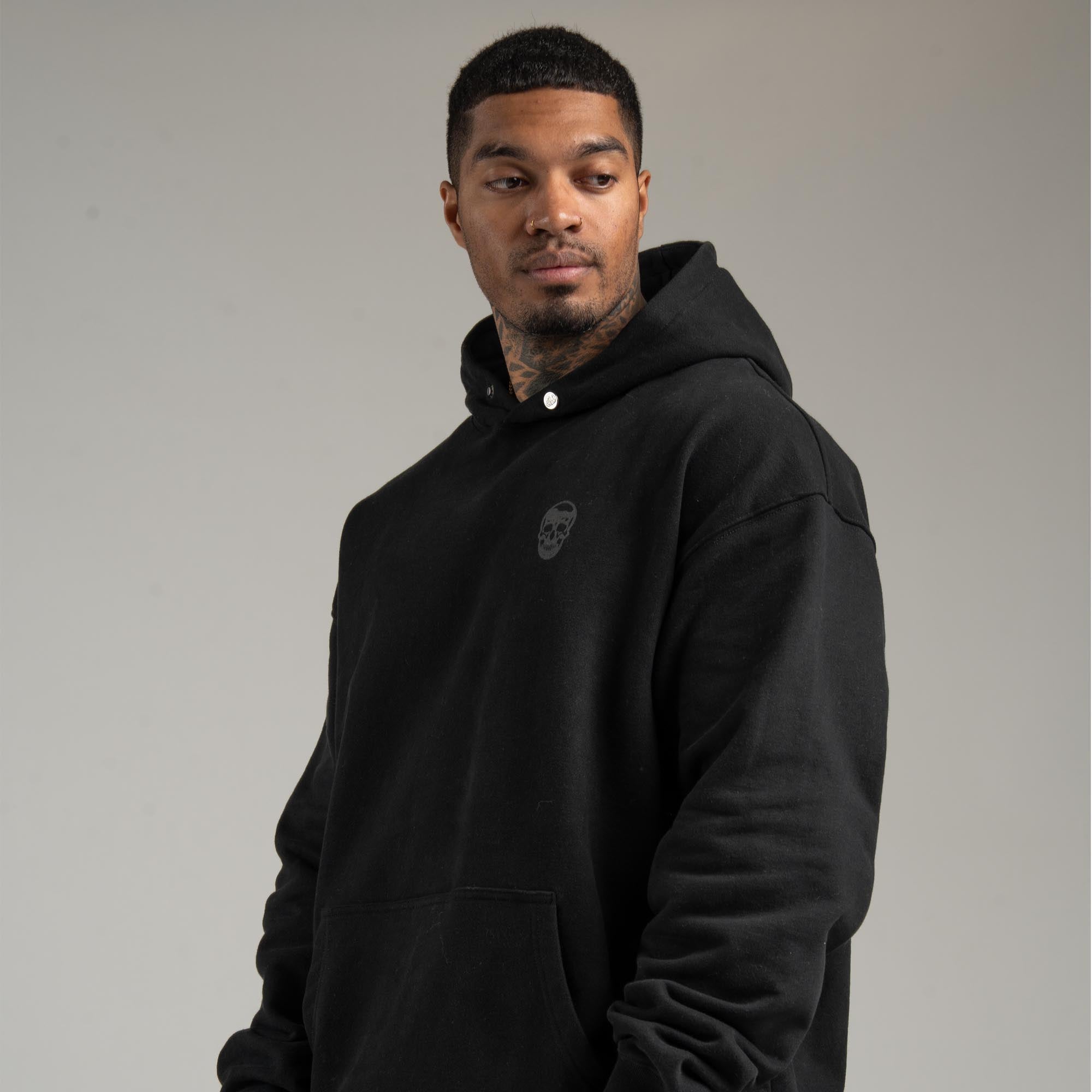 athlete wearing Black/Black Heavyweight Hoodie