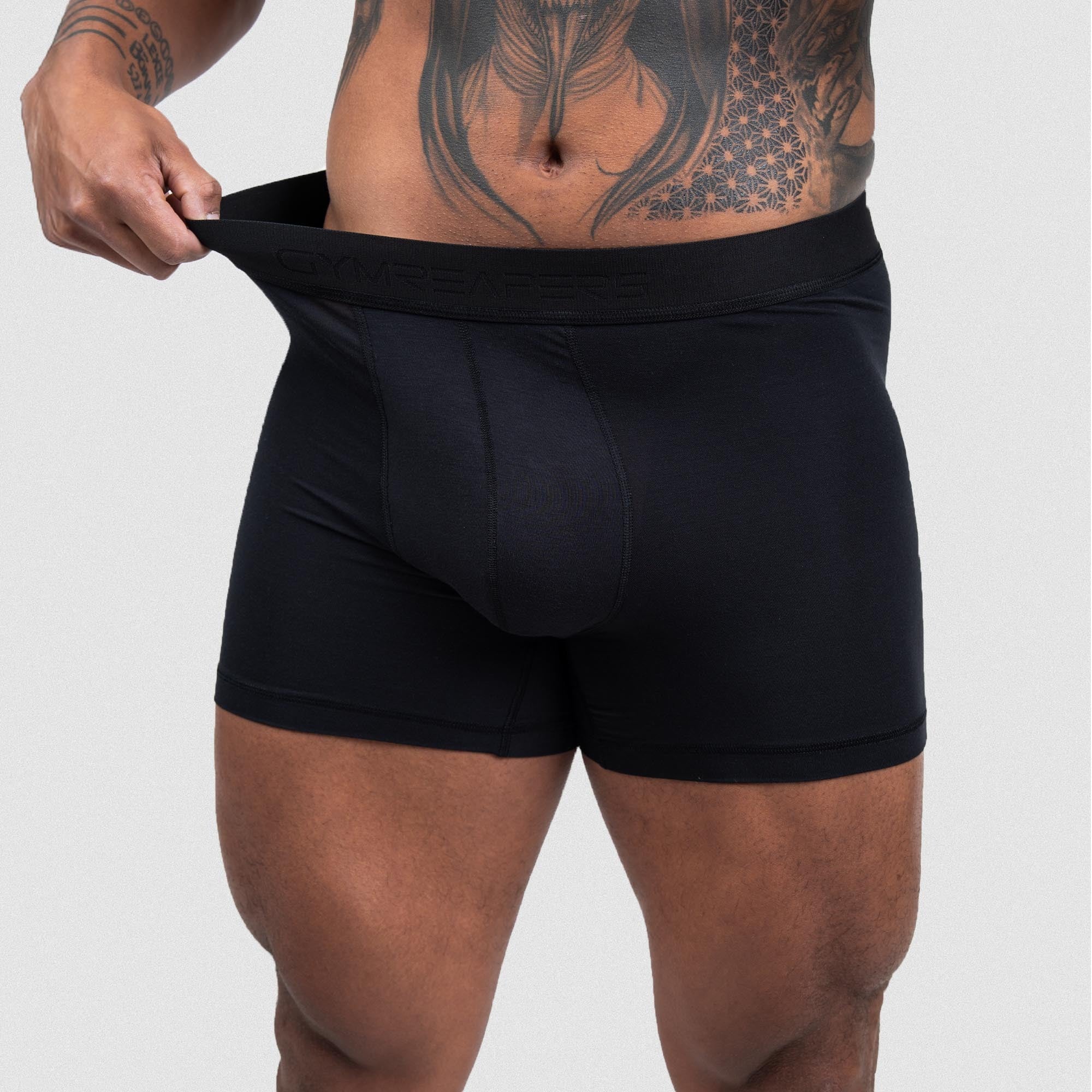 Athlete wearing the Everyday Boxer Briefs showcasing the stretch in the waistband