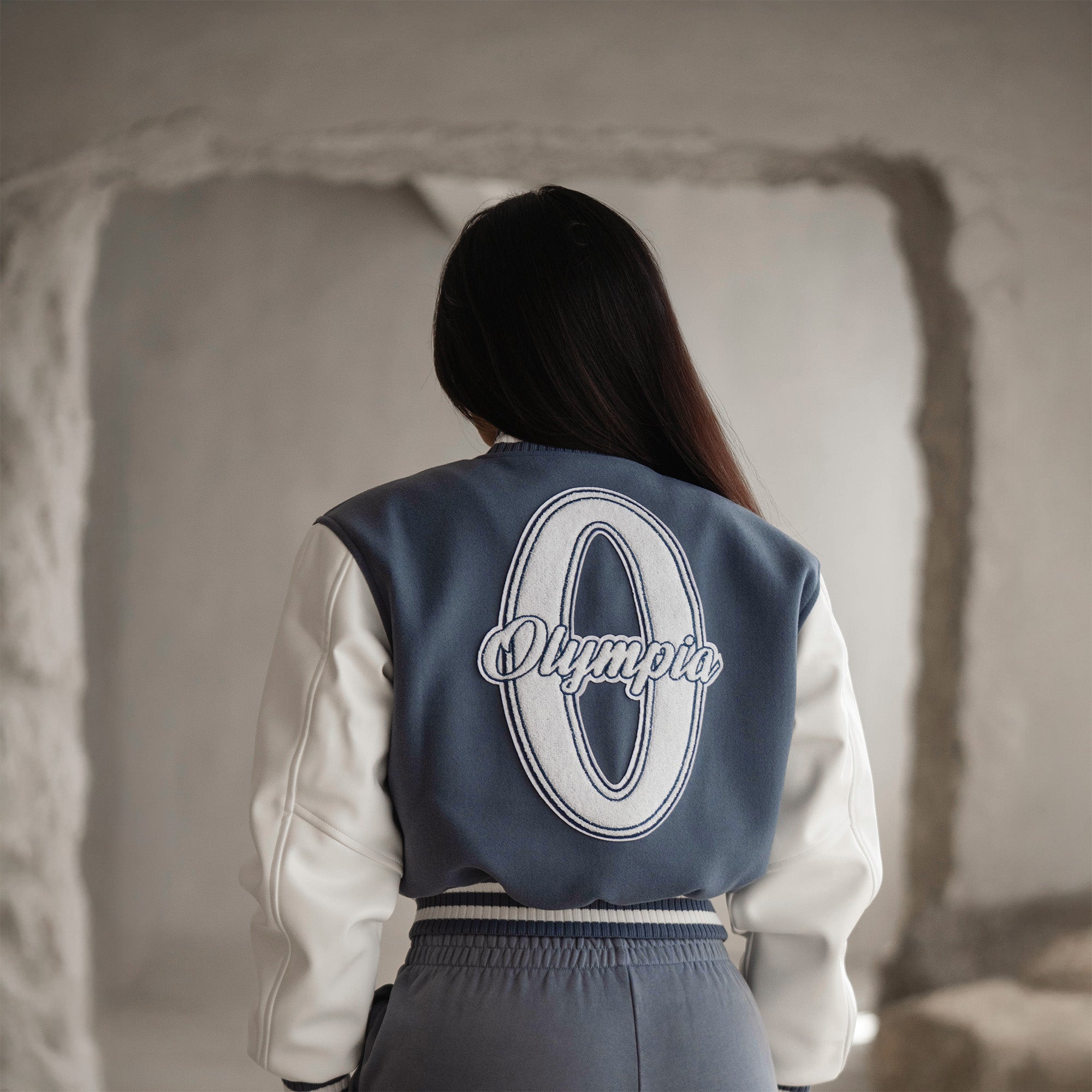 cropped varsity jacket on athlete back view