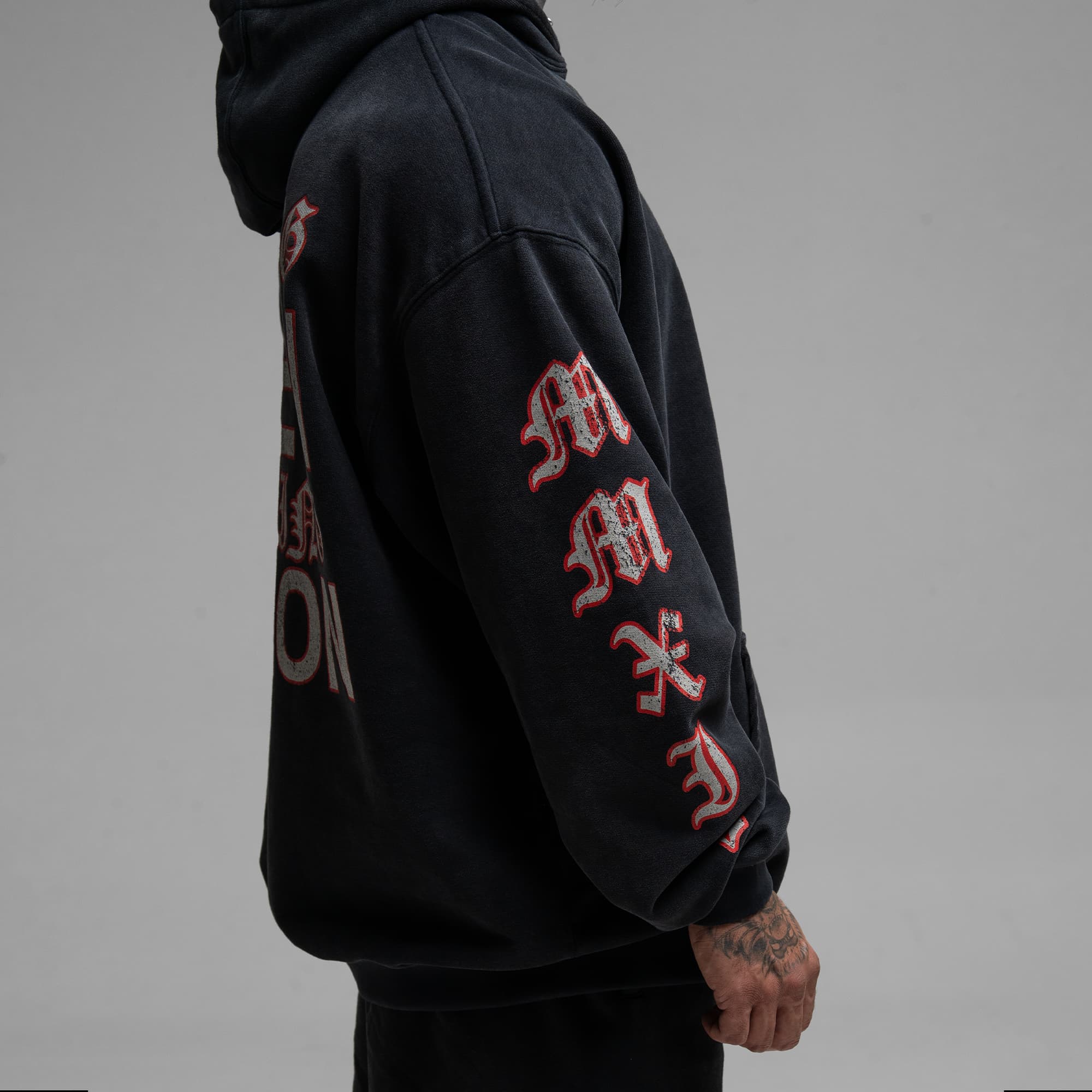 Athlete wearing the Loyalty Club Hoodie half body shot right side view