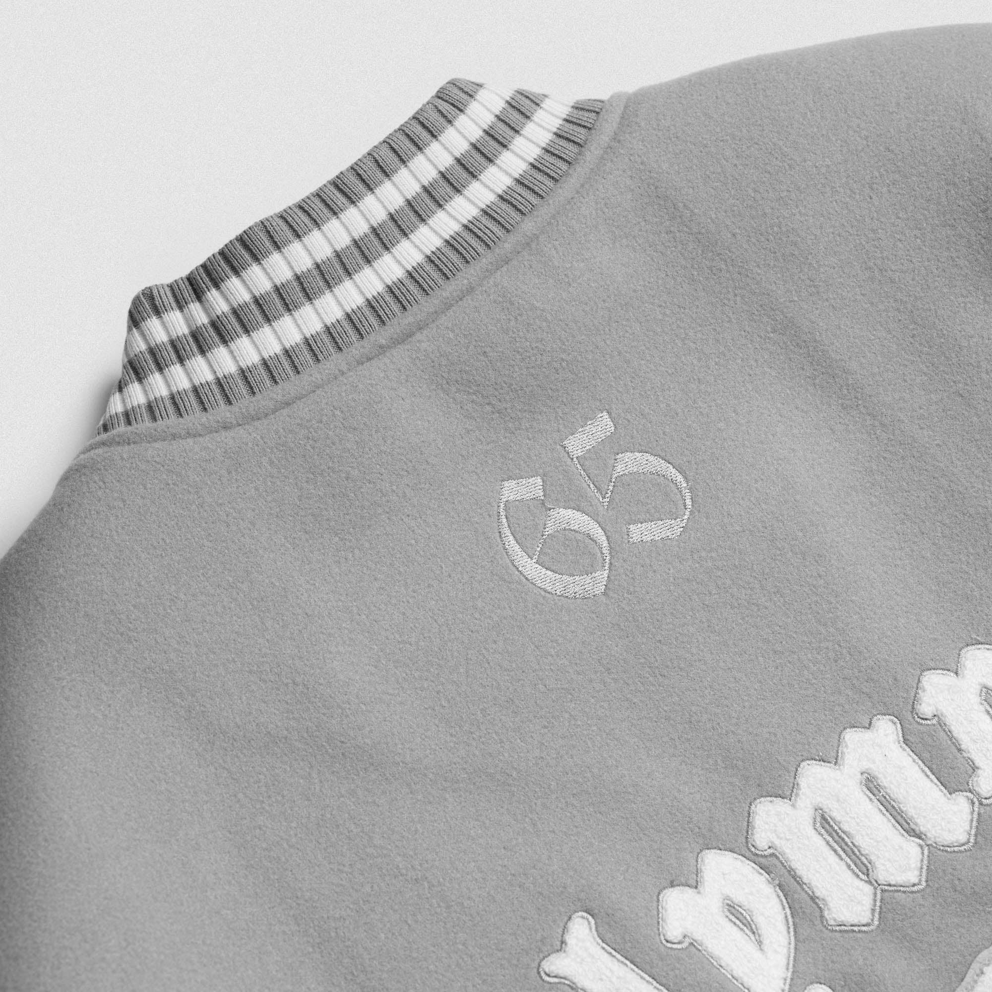 Olympia Lifting Club Varsity Jacket close up of back graphic