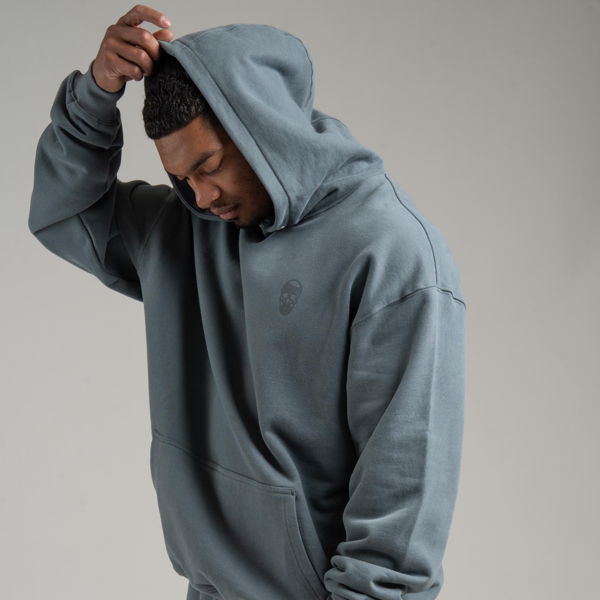 Athlete wearing Lake Heavyweight Hoodie with hood on