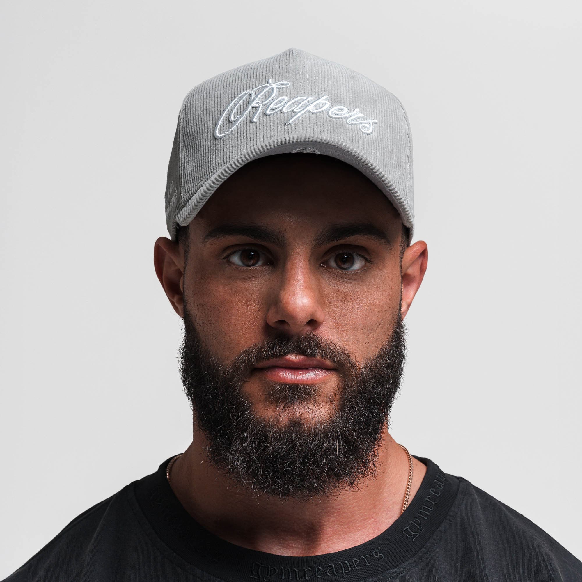 Athlete wearing Corduroy Reapers 5-Panel Hat - Gray/White front view