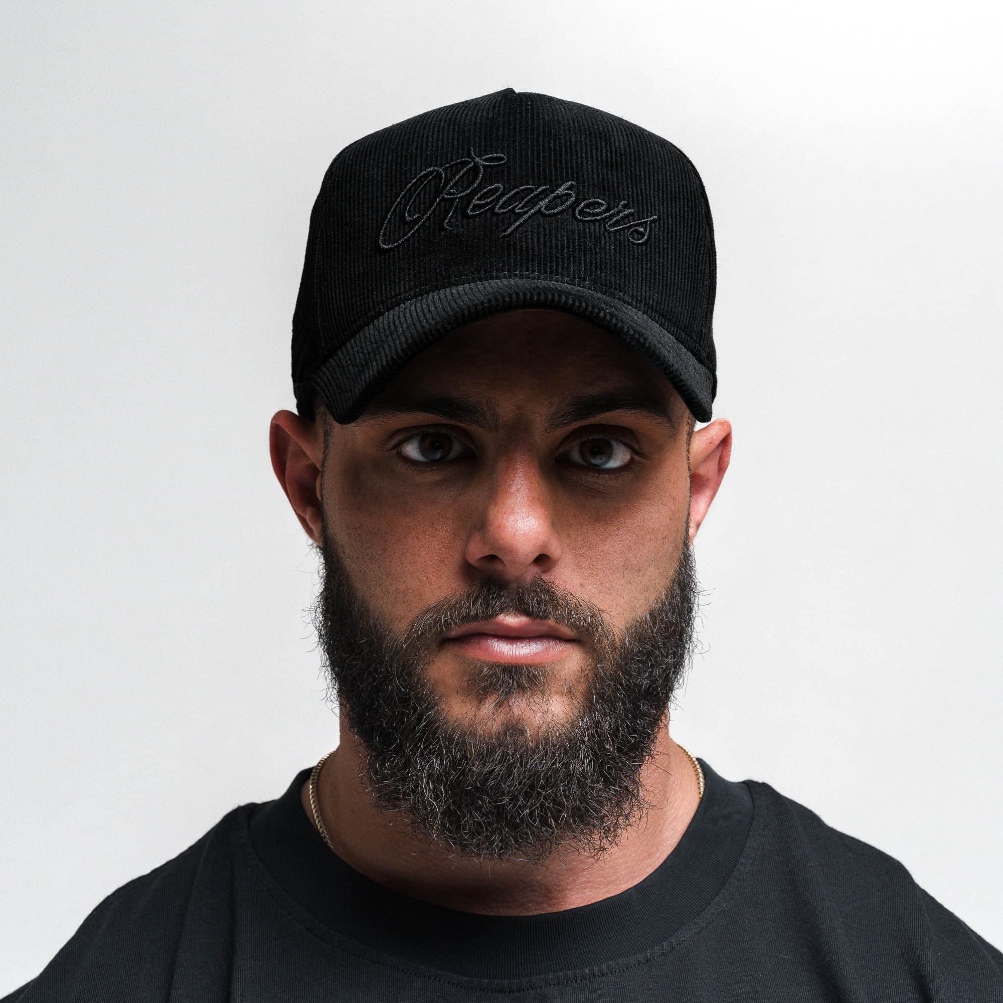 Athlete wearing Corduroy Reapers 5-Panel Hat - Black/Black front view