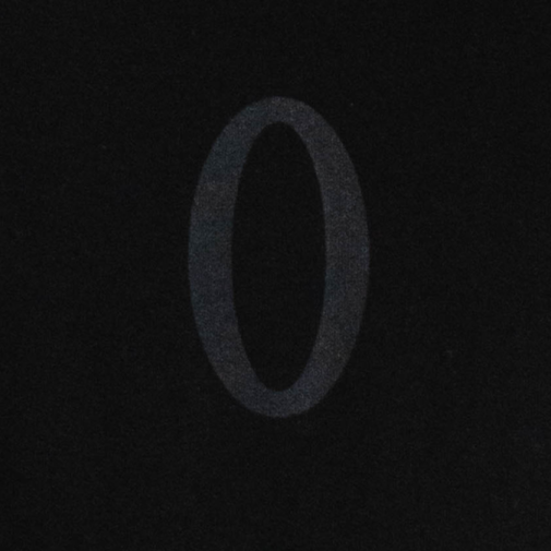 Close-up of tonal “O” logo detail on chest of Raw Hem Olympia Stringer.