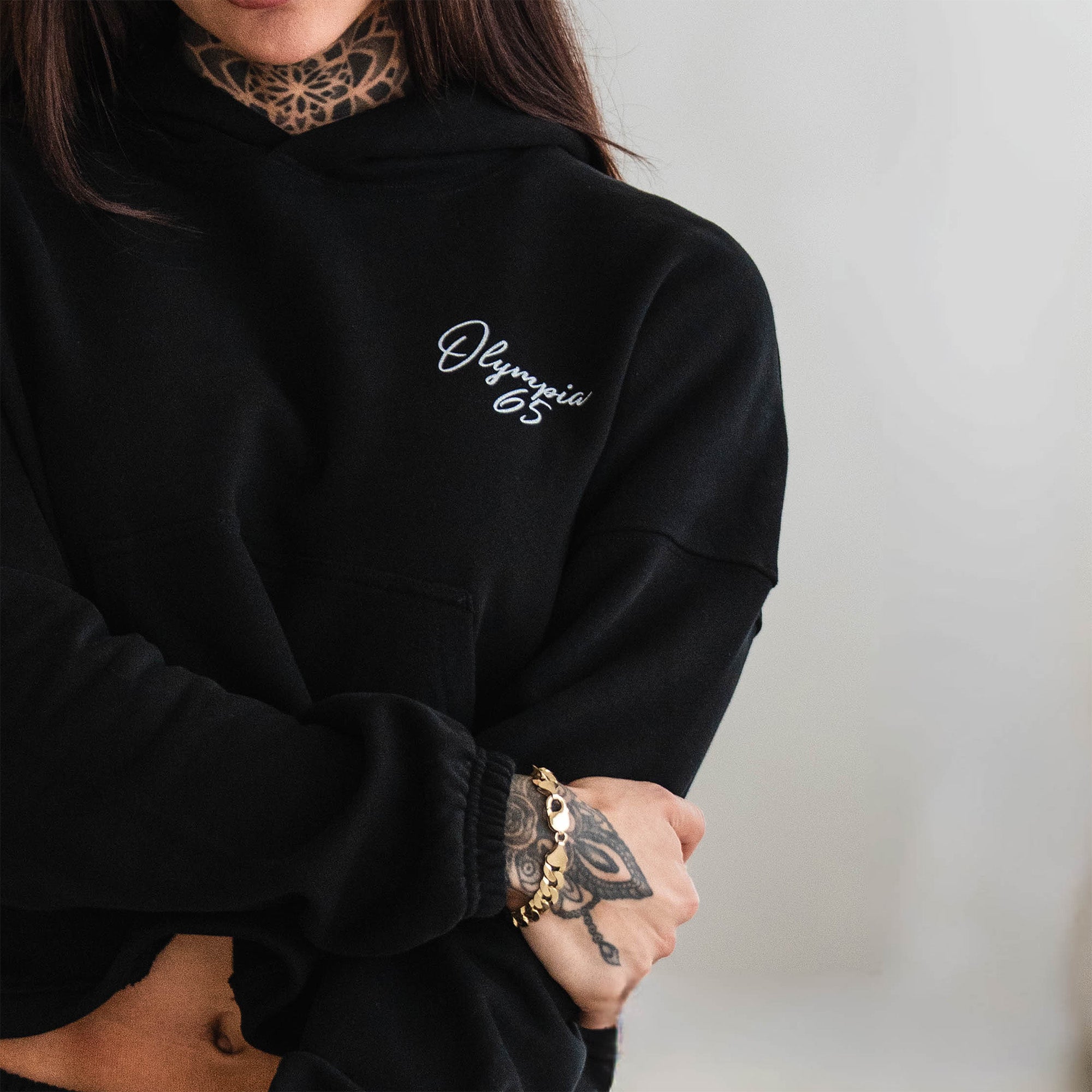Olympia Script Cropped Hoodie close up on wrist cuff