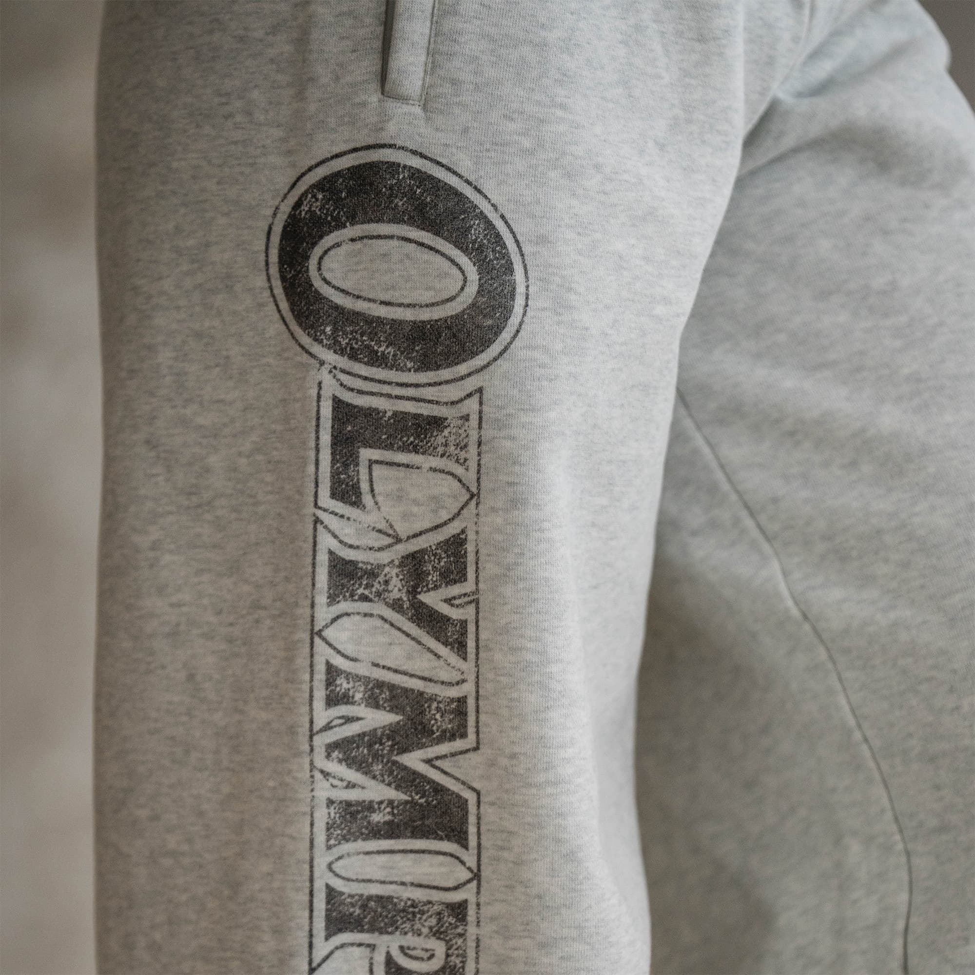 The Olympia Wide Leg Jogger close up shot of right side logo