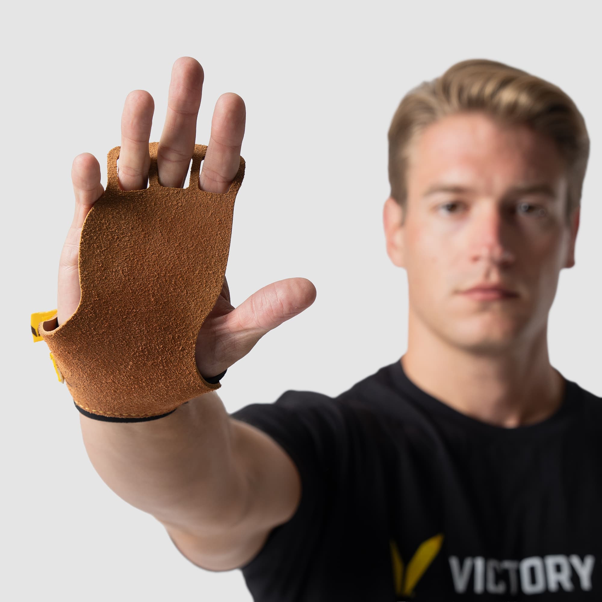Men's V-Series 3-FC Leather in Tan – Hand towards camera with focus on the Leather Grip