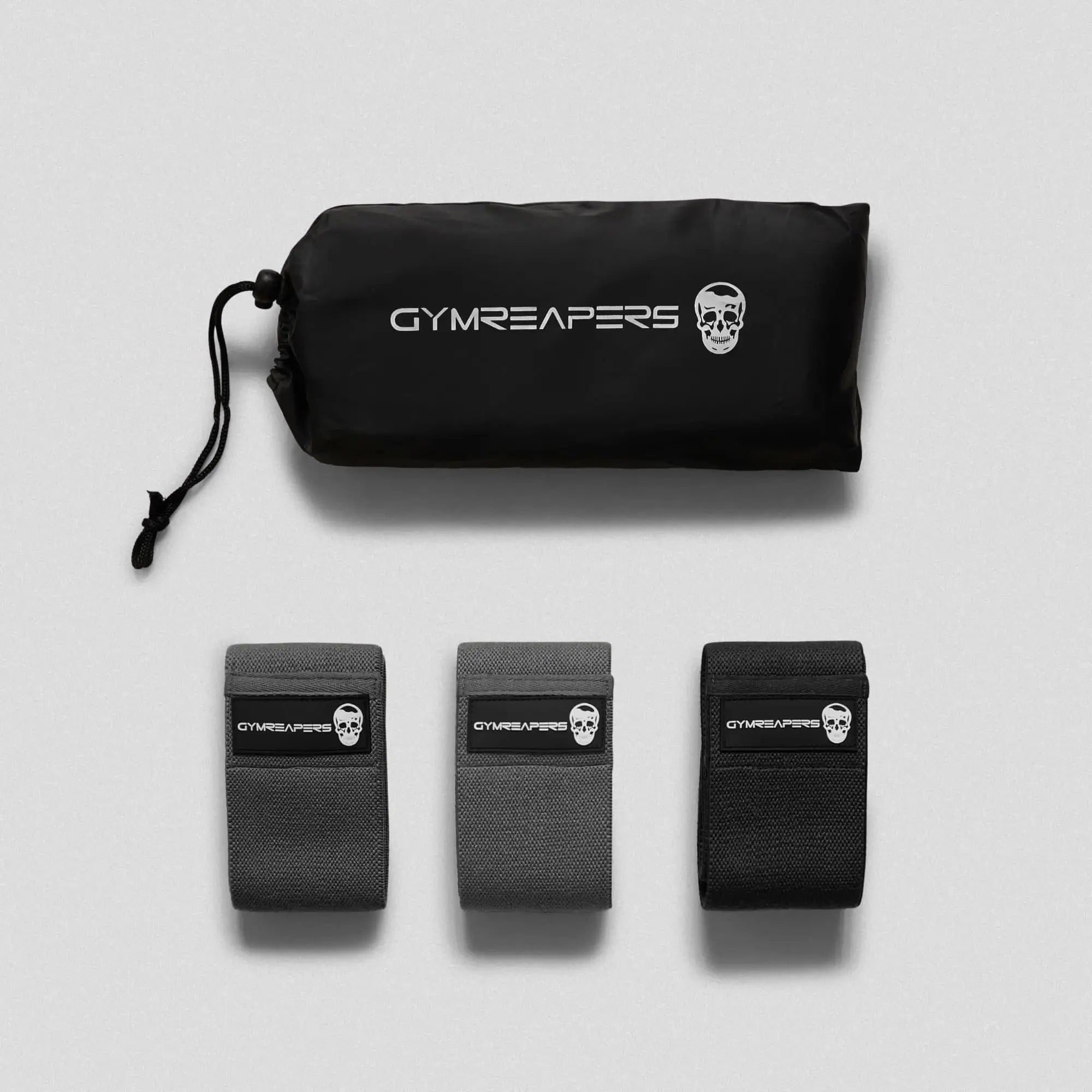 photo of black hip bands and carry bag on gray background