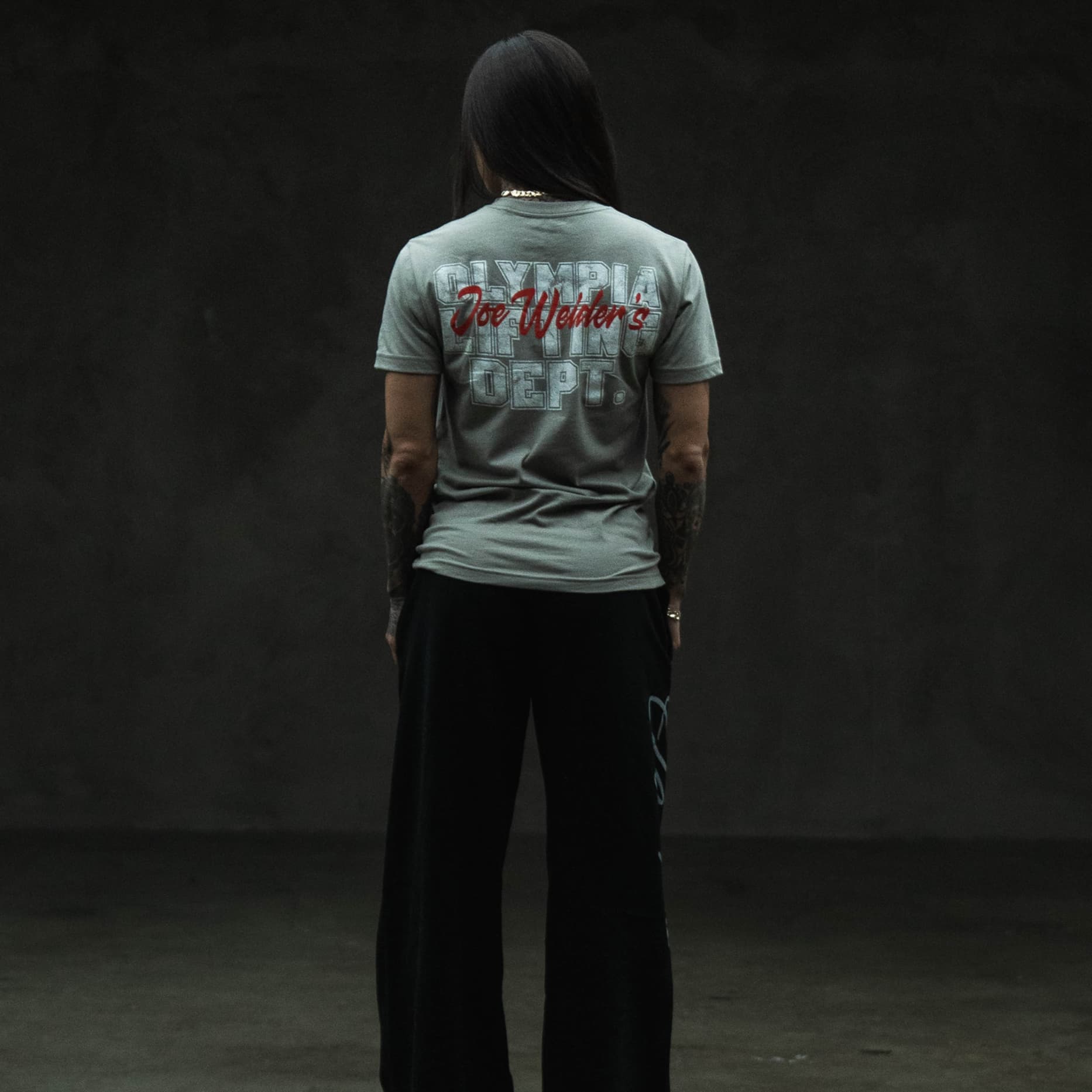 full body lifestyle shot of athlete wearing the lifting department tee showing back graphic