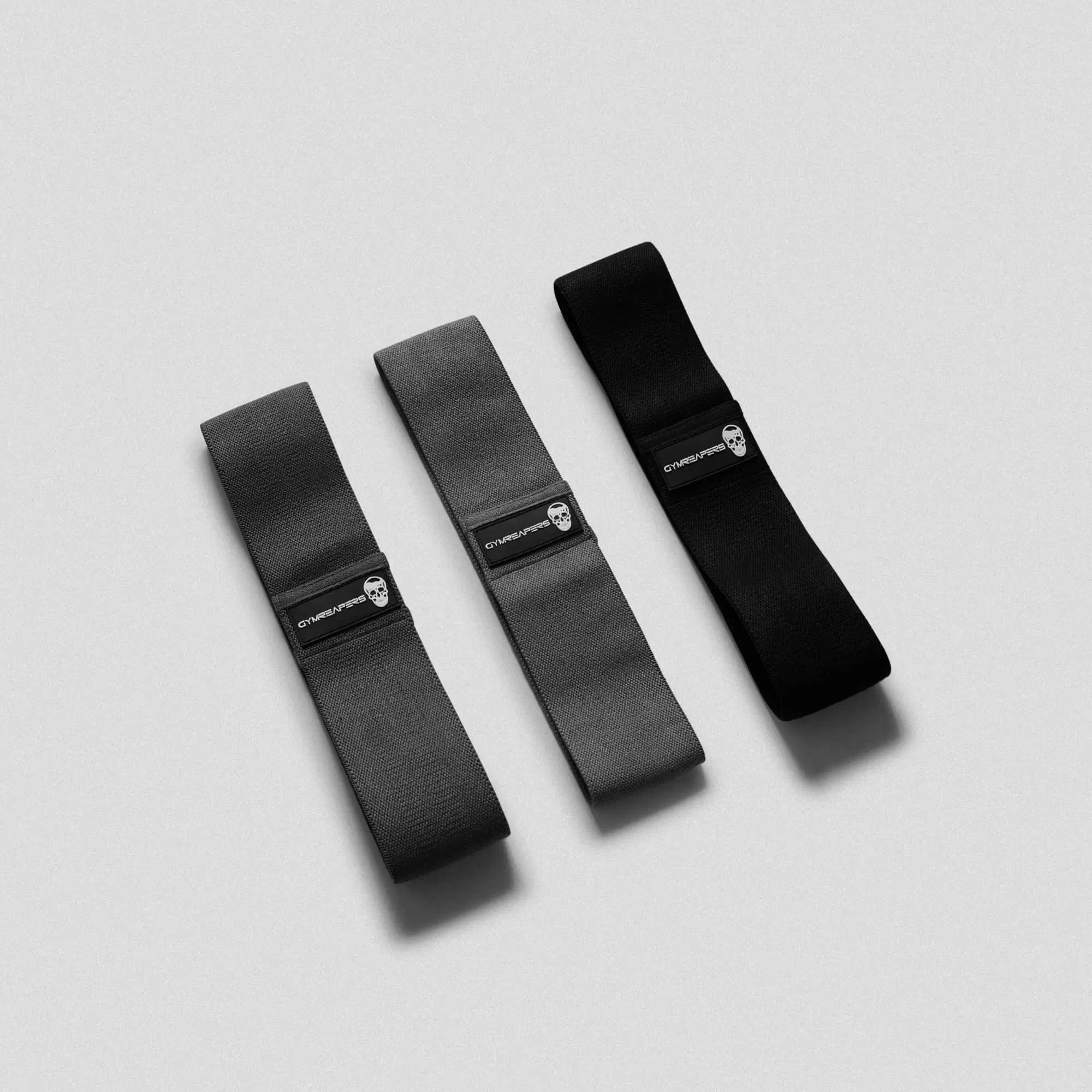 photo of black hip bands side by side on gray background