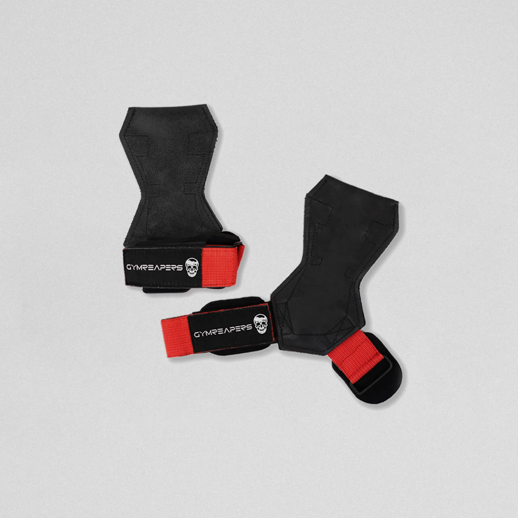 Gymreapers lifting grips red one strap closed and the other laying flat and open.