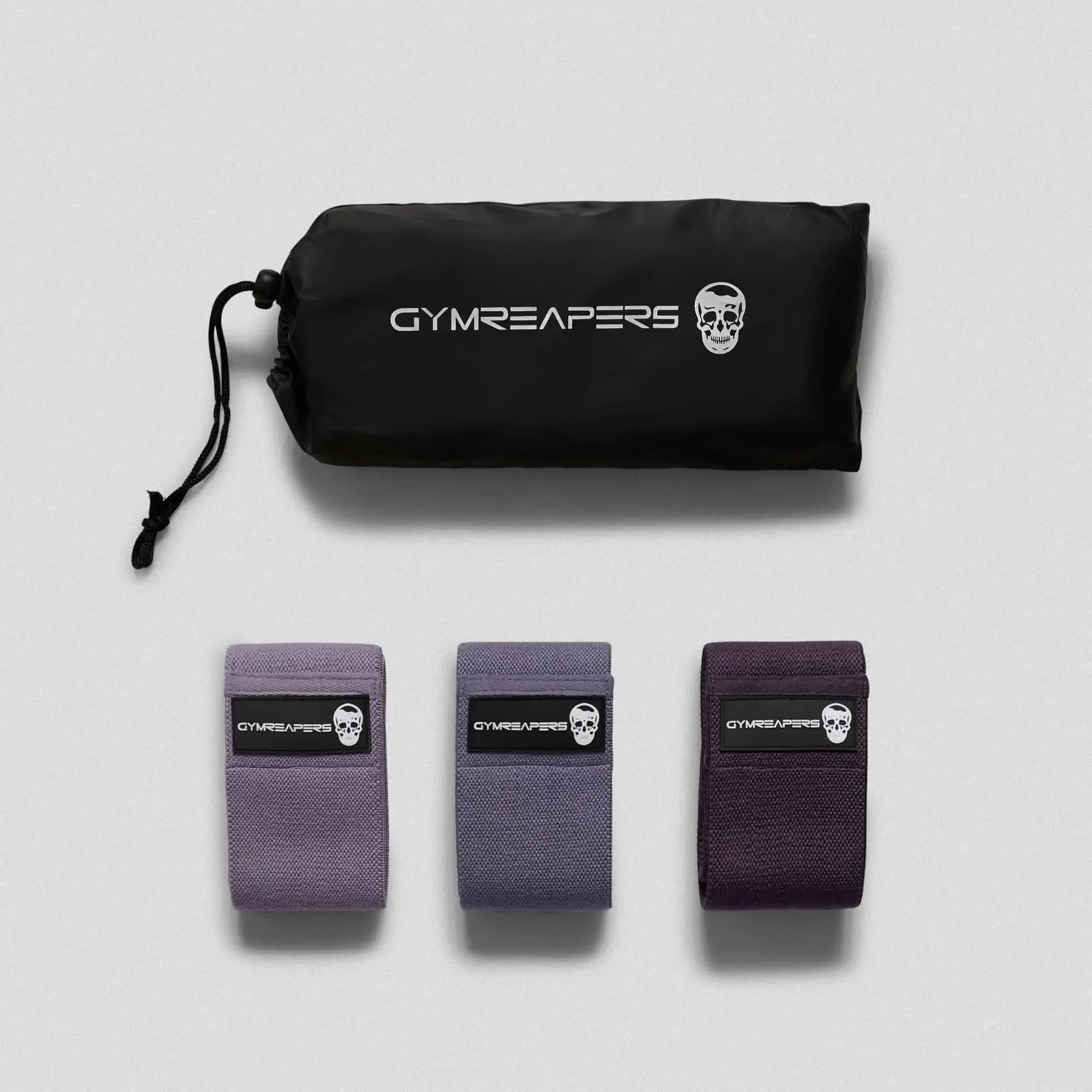 photo of purple hip bands side by side with bag on gray background
