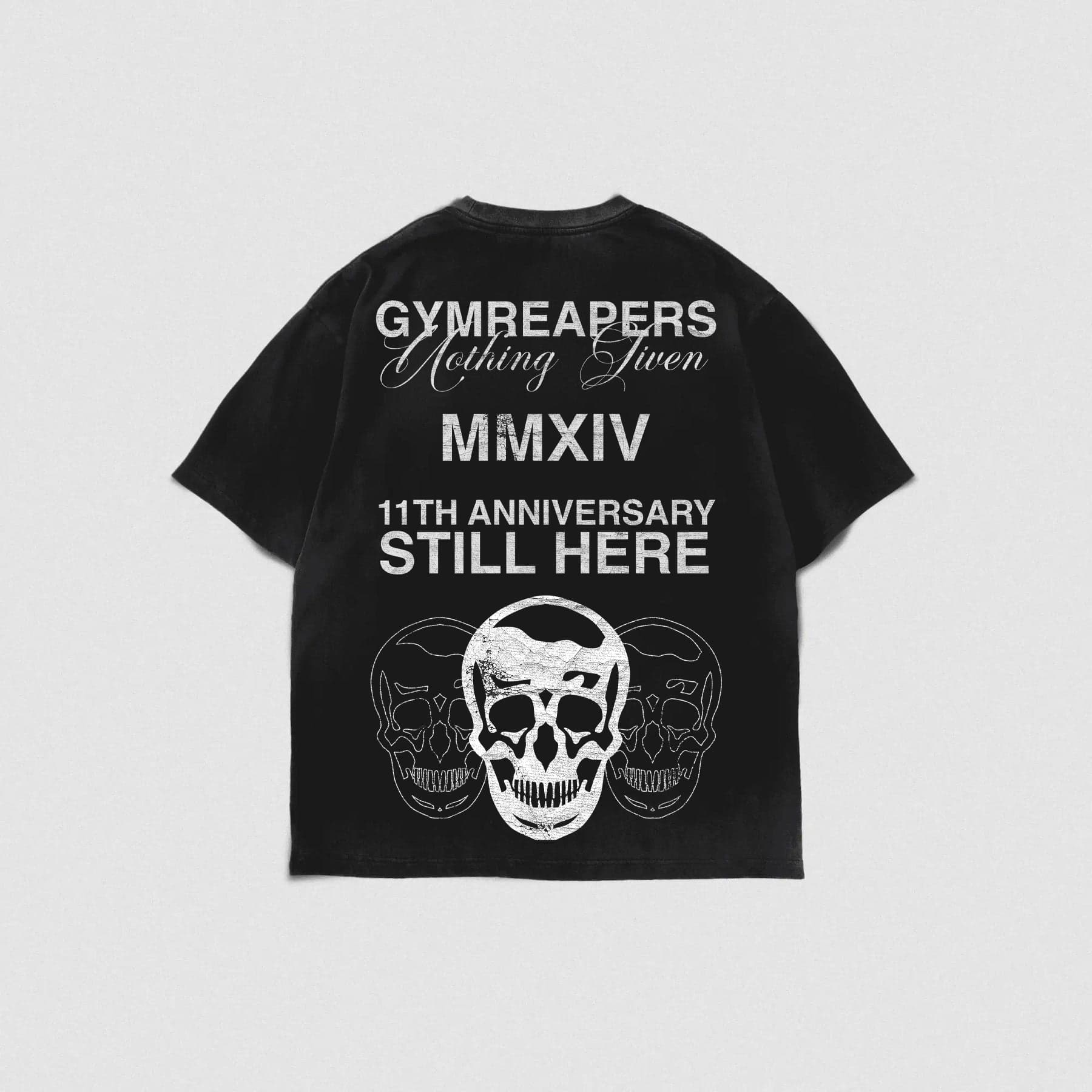 Layflat back shot of 11th anniversary tee on studio gray background.