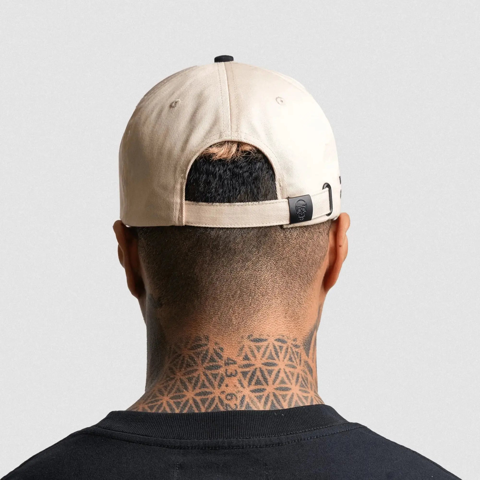5 panel skull hat cream black on athlete back view