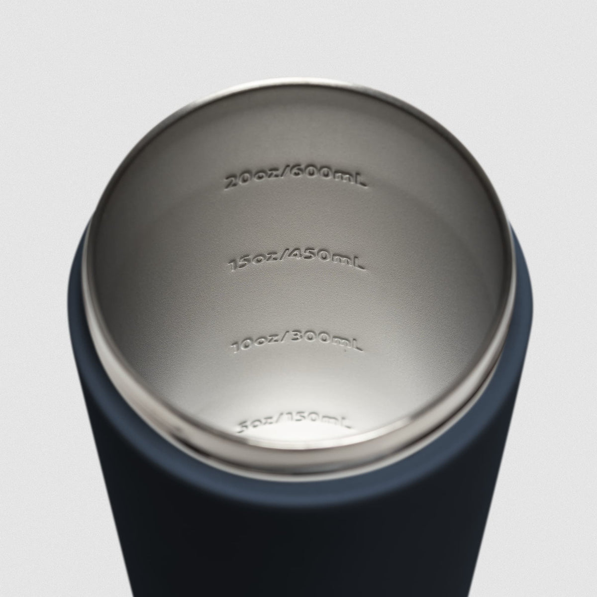 Navy blue Stainless Steel Shaker on white background showcasing inside of shaker and measurement lines