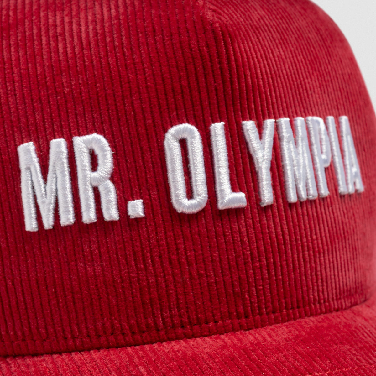 Front close up on the Mr. Olympia text found above the bill of the Mr. Olympia Corduroy 5-Panel Hat
