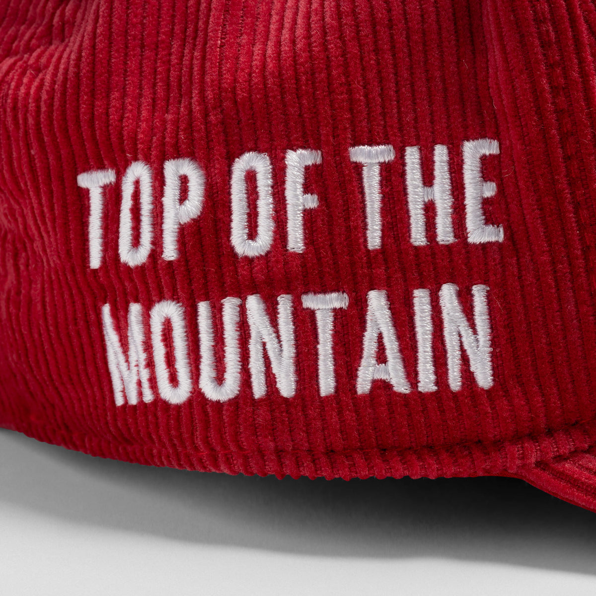 Top of the Mountain text on the side of the Mr. Olympia Corduroy 5-Panel Hat
