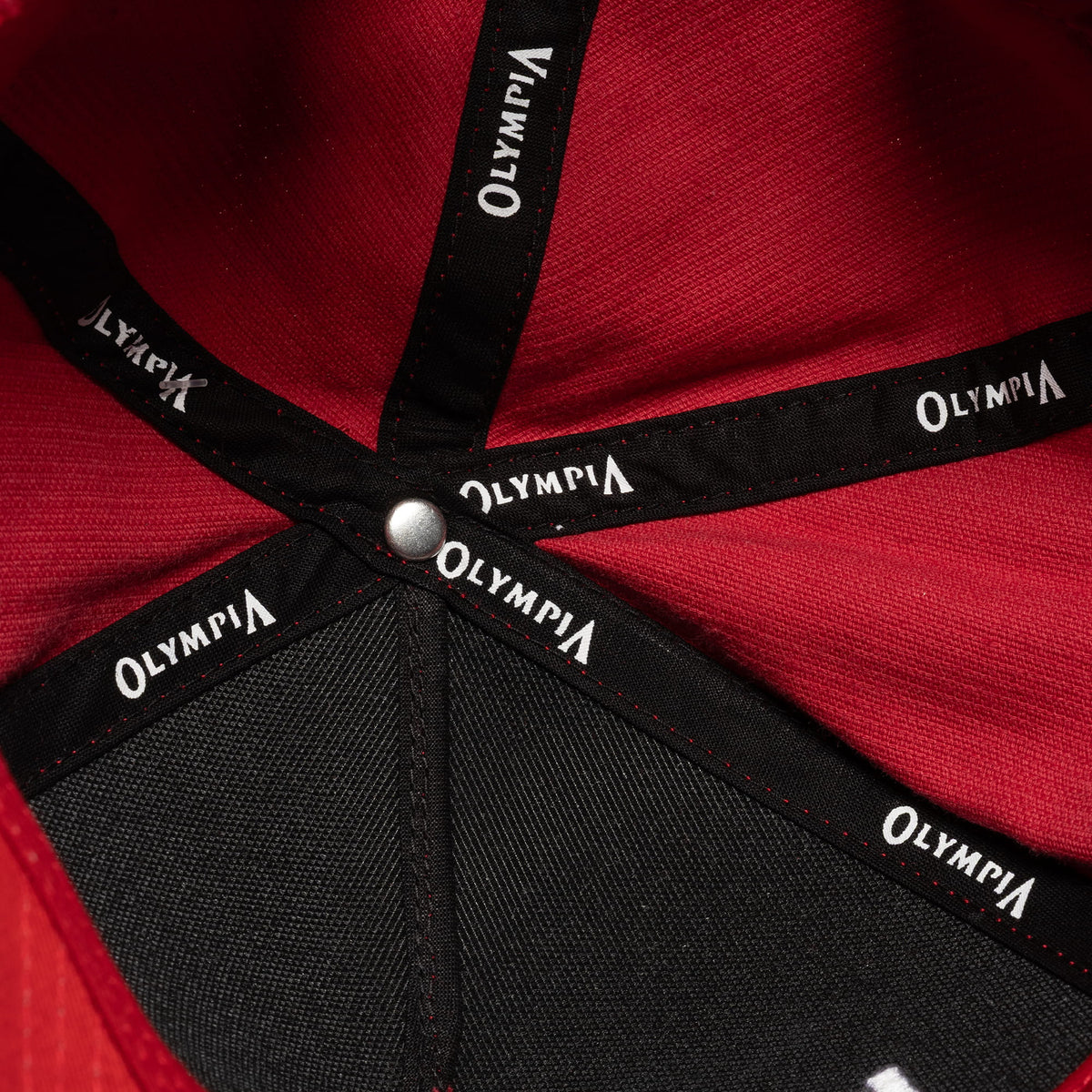 Inside of the Mr. Olympia Corduroy 5-Panel Hat that displays the Olympia text on the internal structure of the hat