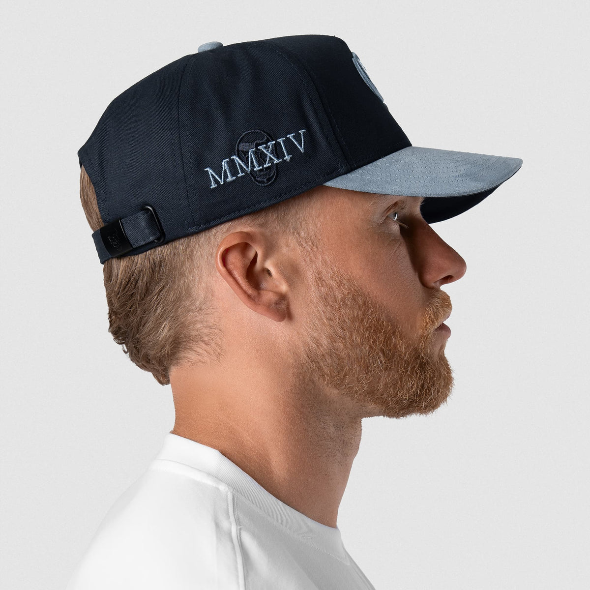 Male model wearing the 5-Panel Initial Suede Hat - Blue right side view