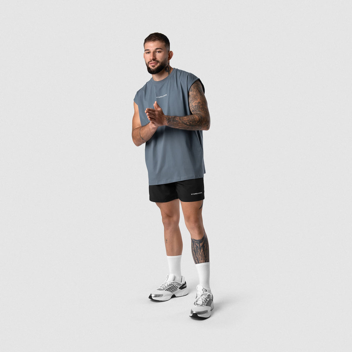 Male model wearing the Axis 6" Lined Shorts - Black/White full-body view