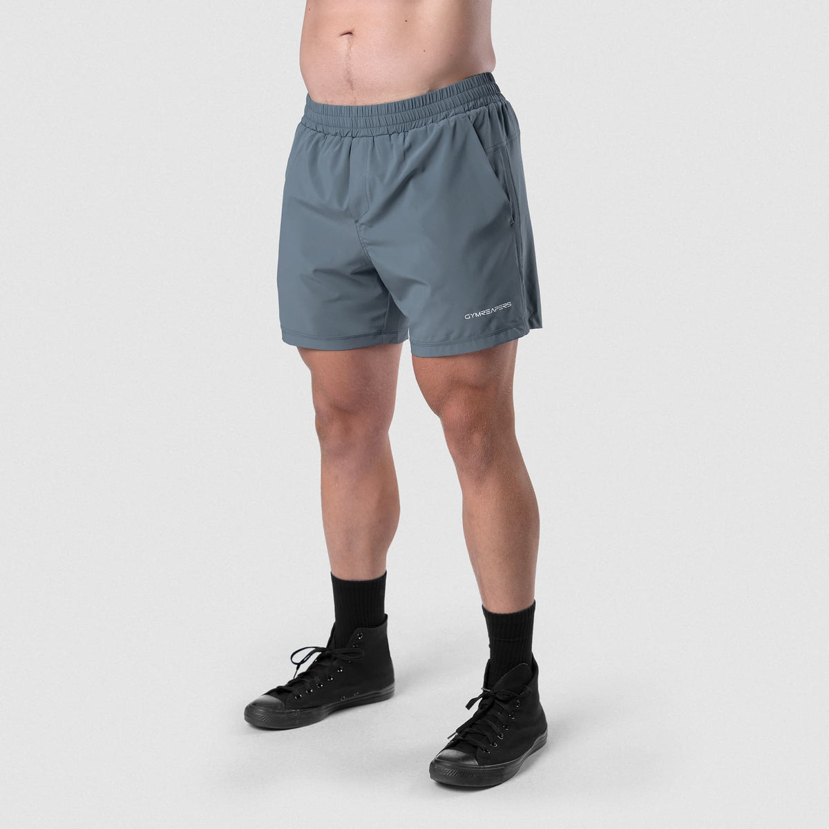 Male model wearing the Axis 6" Lined Shorts - Lake lower-body view