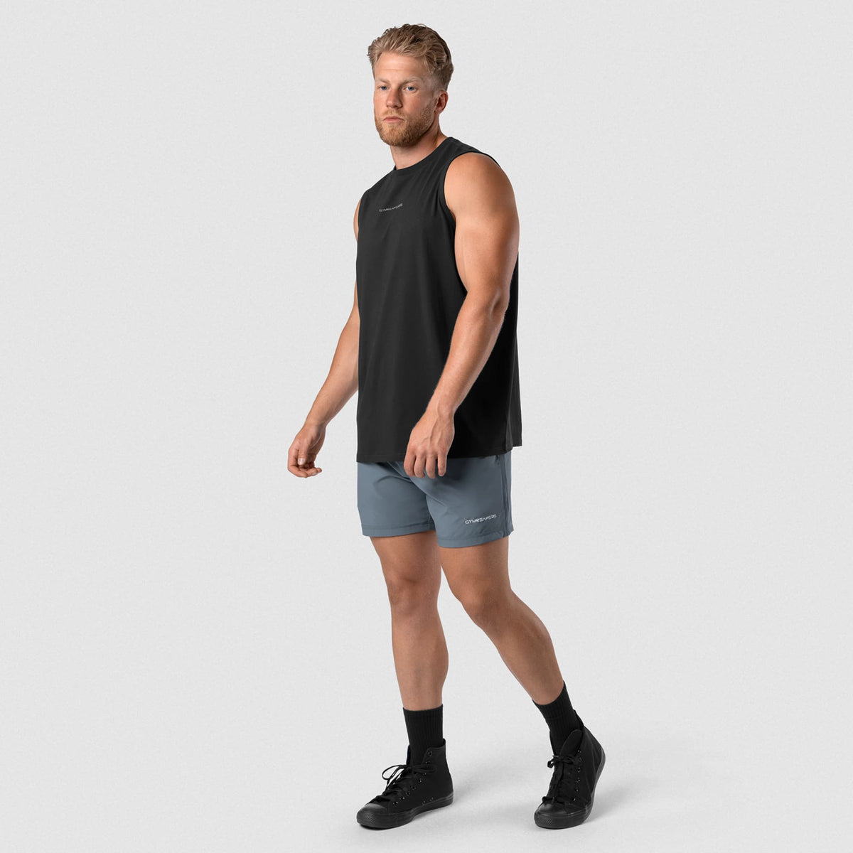 Man wearing Axis Muscle Tank - Black/White full-body walking view