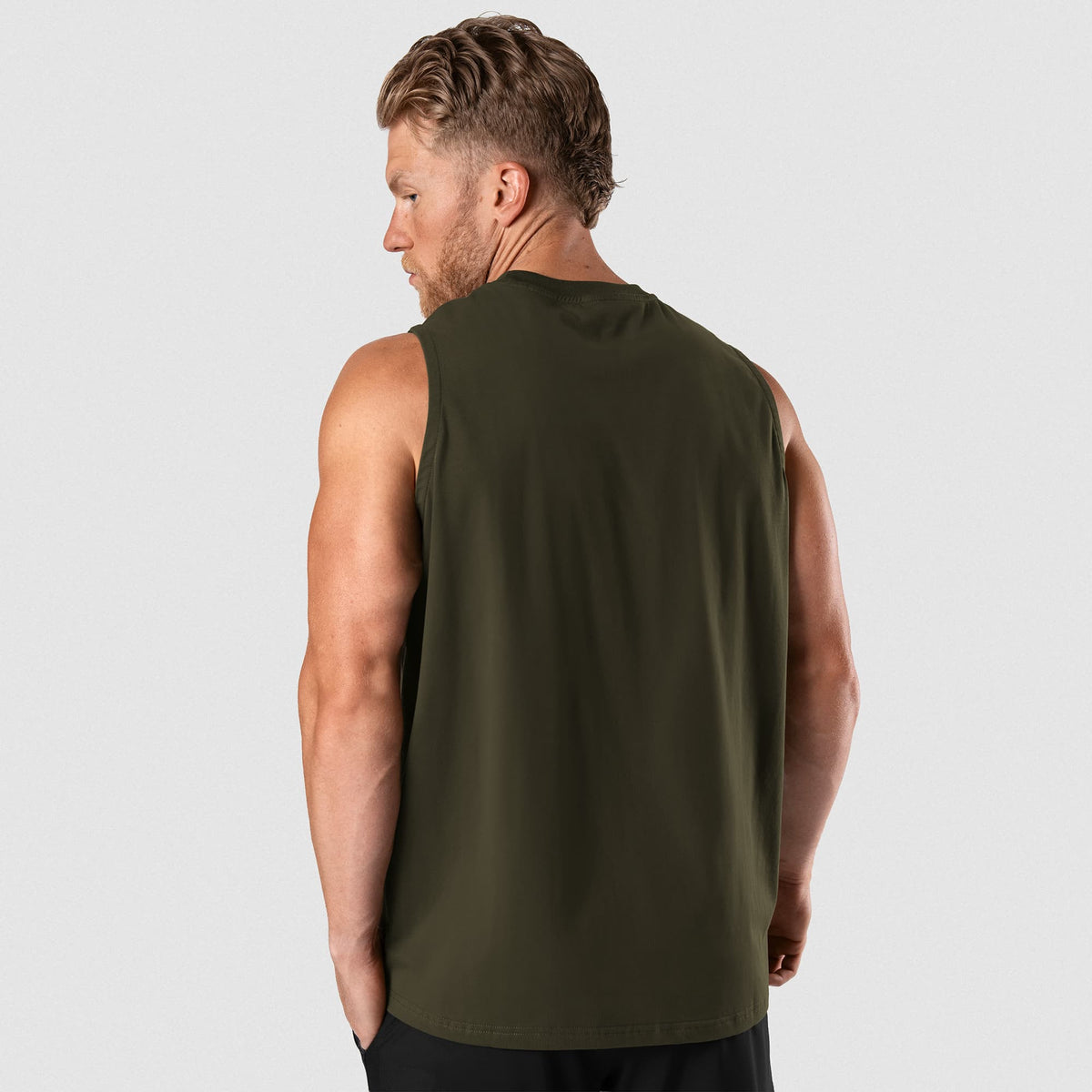 Male model wearing the Axis Muscle Tank - OD Green back view