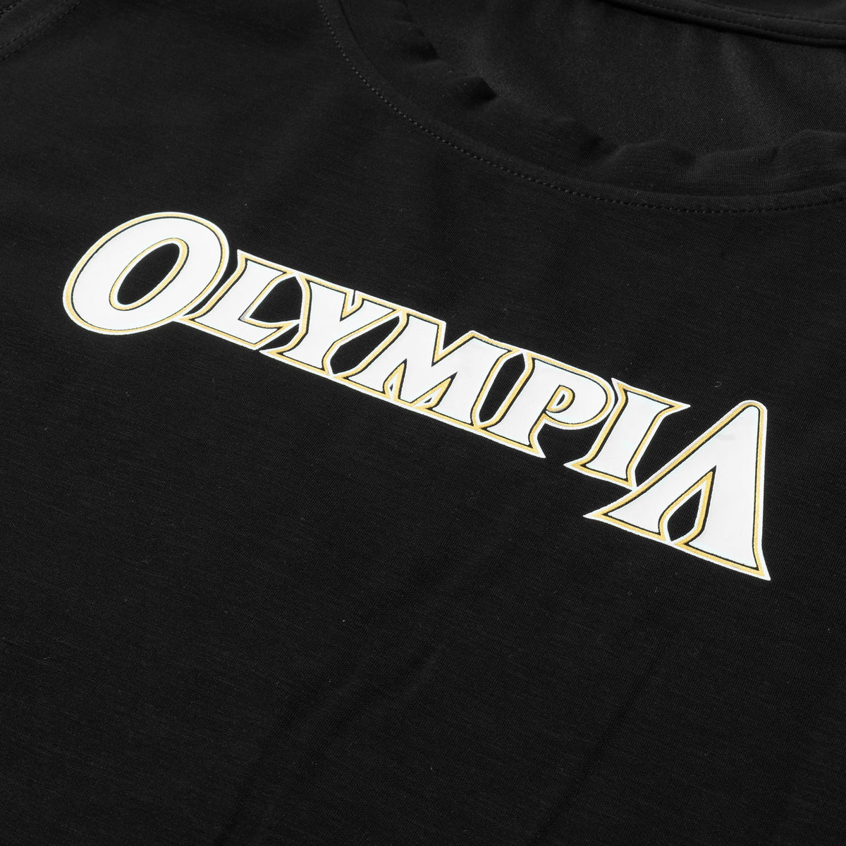 Flatlay view of the "OLYMPIA" wordmark logo across the chest of the Champions Gold Full Length Training Tank