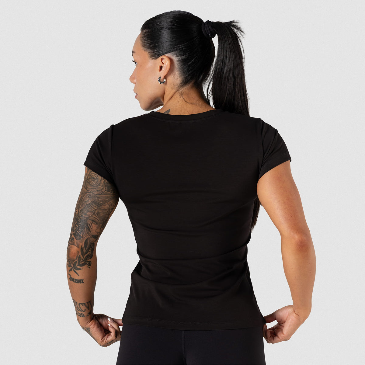 Back of the full length Champions Gold Women's Training Tee