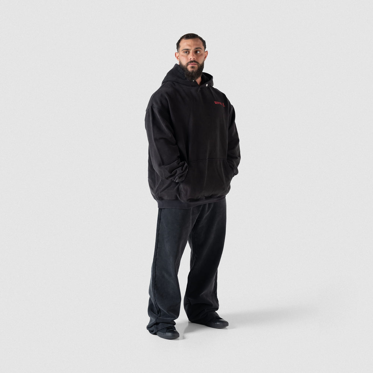 Full body view of male model wearing the Championship Straight-Leg Jogger paired with a black hoodie