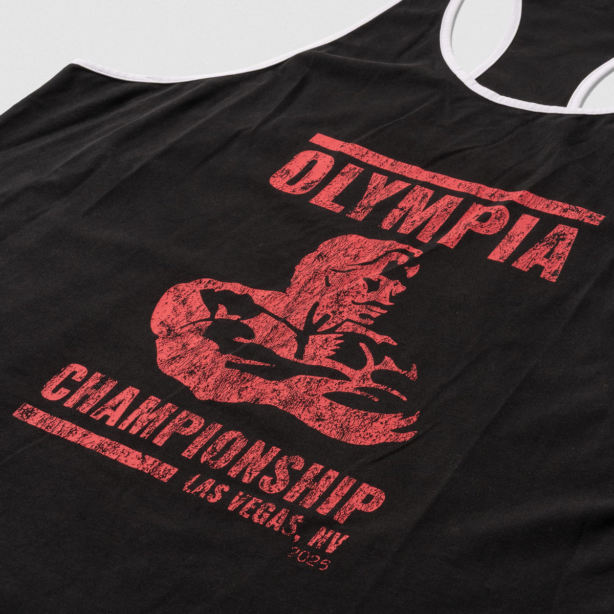 Close up view of the large front distressed graphic with the "Olympia Championship, Las Vegas NV 2026" wordmark paired with the Olympia logo