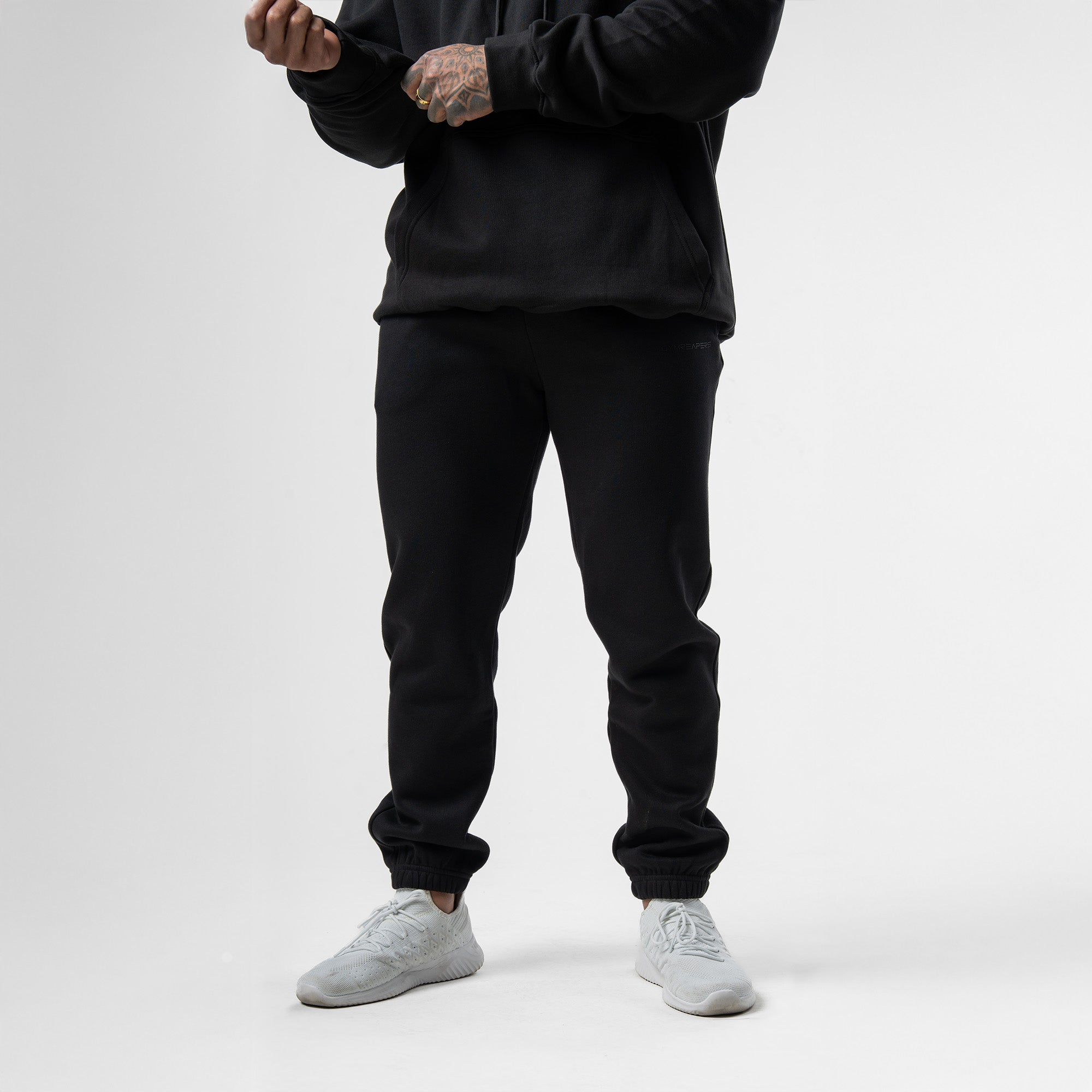 athlete wearing axis joggers half body shot